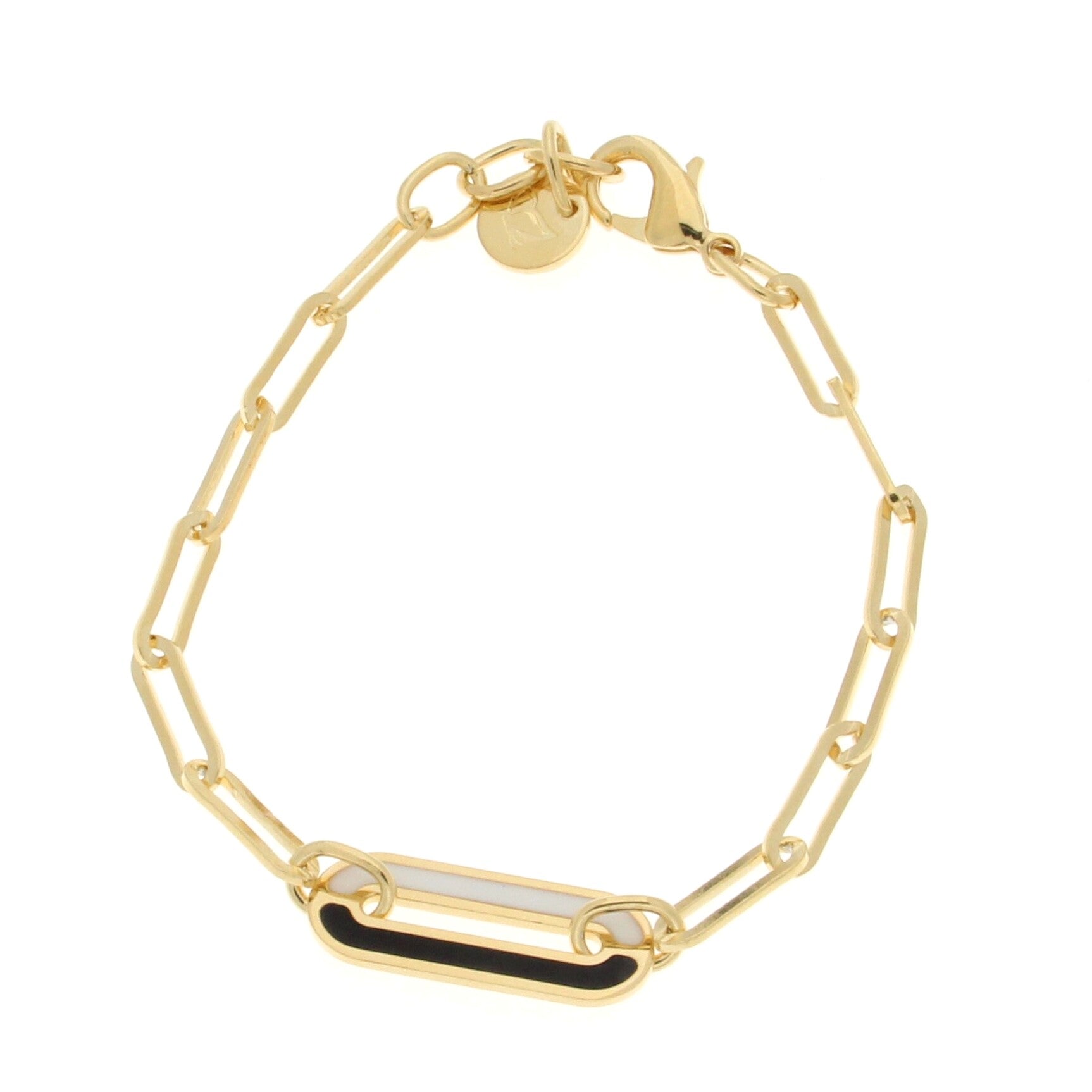 Gold chain bracelet featuring elongated links, accented by a central rectangular bar with a black and white enamel design, secured with a lobster clasp.