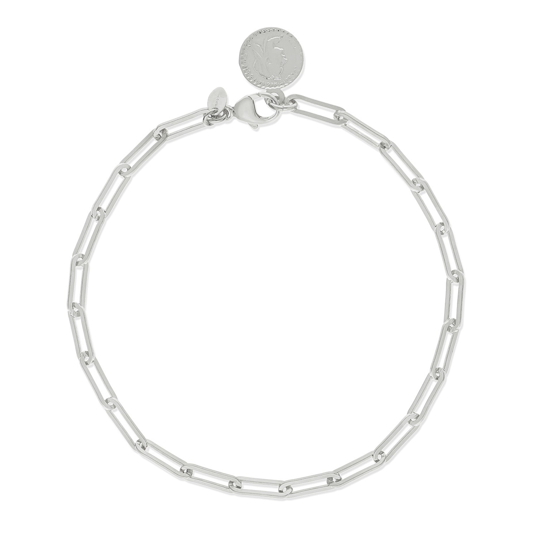 A sleek silver-tone anklet featuring an elongated link chain design. The anklet showcases shiny, rectangular links with a polished finish, complemented by a circular charm at the clasp that adds a touch of elegance.