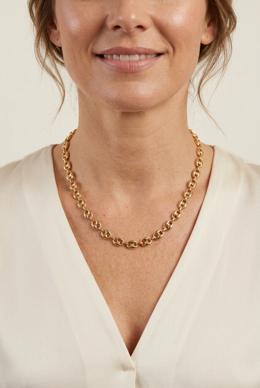Model wearing the gold oval-link necklace