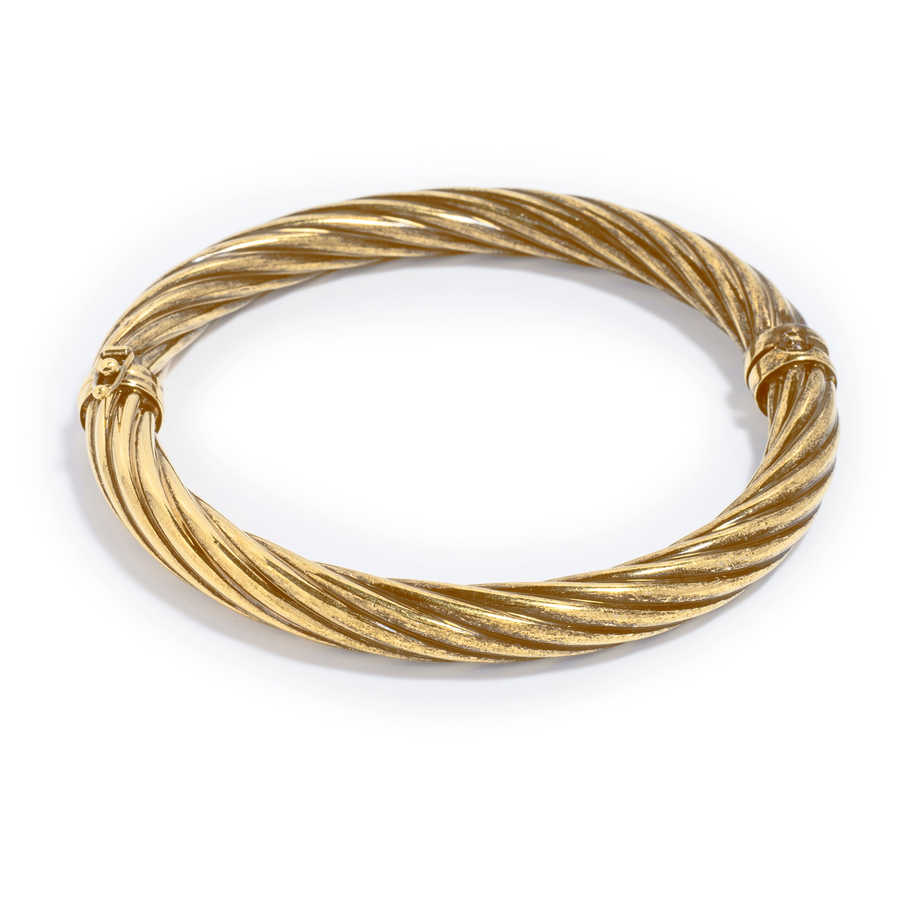 A stylish gold-tone bracelet featuring a twisted rope design. The bracelet has a smooth, polished finish with a textured surface, creating a sophisticated look.