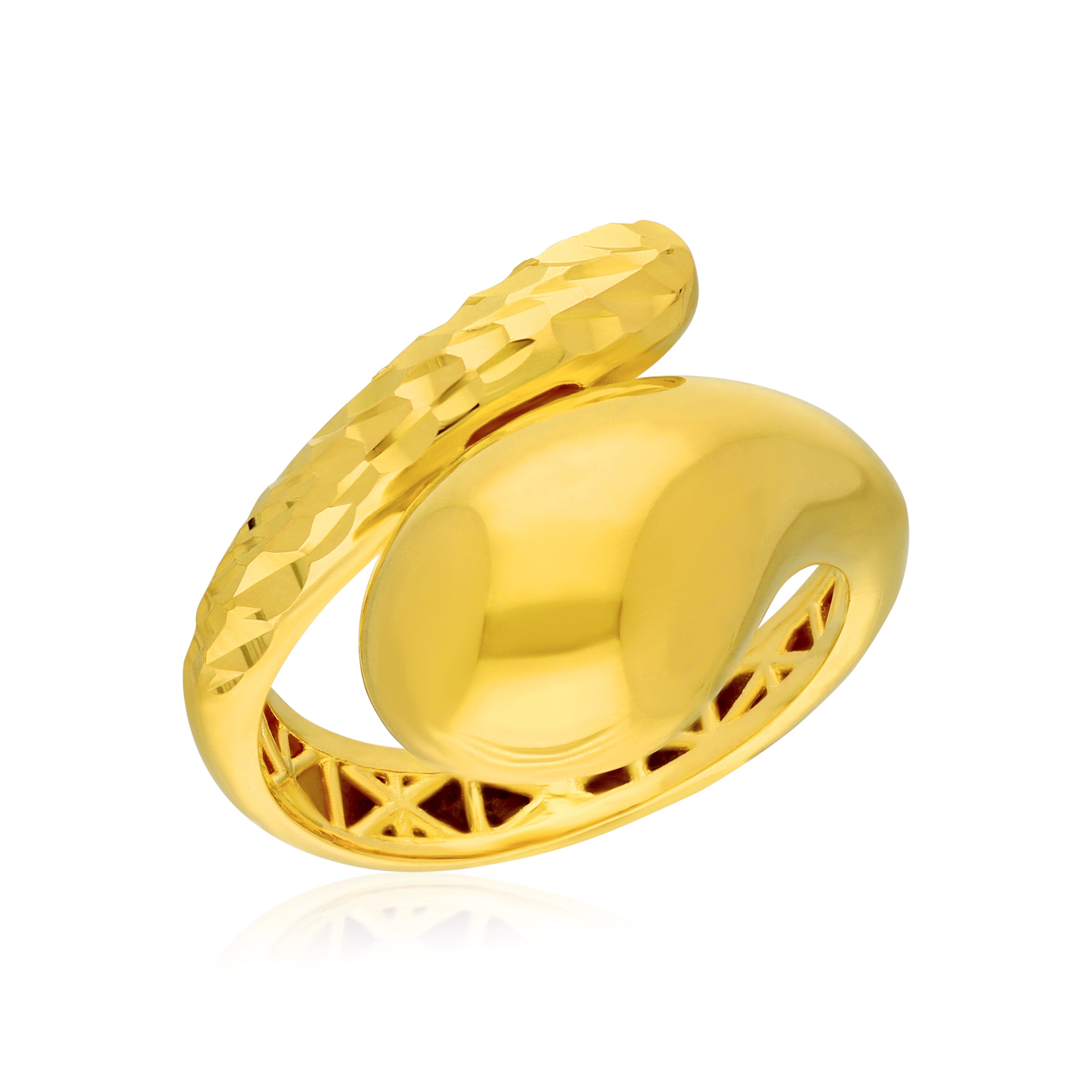 A striking gold ring featuring a unique design with two interlocking elements. One side has a smooth, rounded surface, while the other side is adorned with a textured, faceted finish. The ring has an open band with an intricate geometric pattern on the inside, adding to its modern aesthetic.