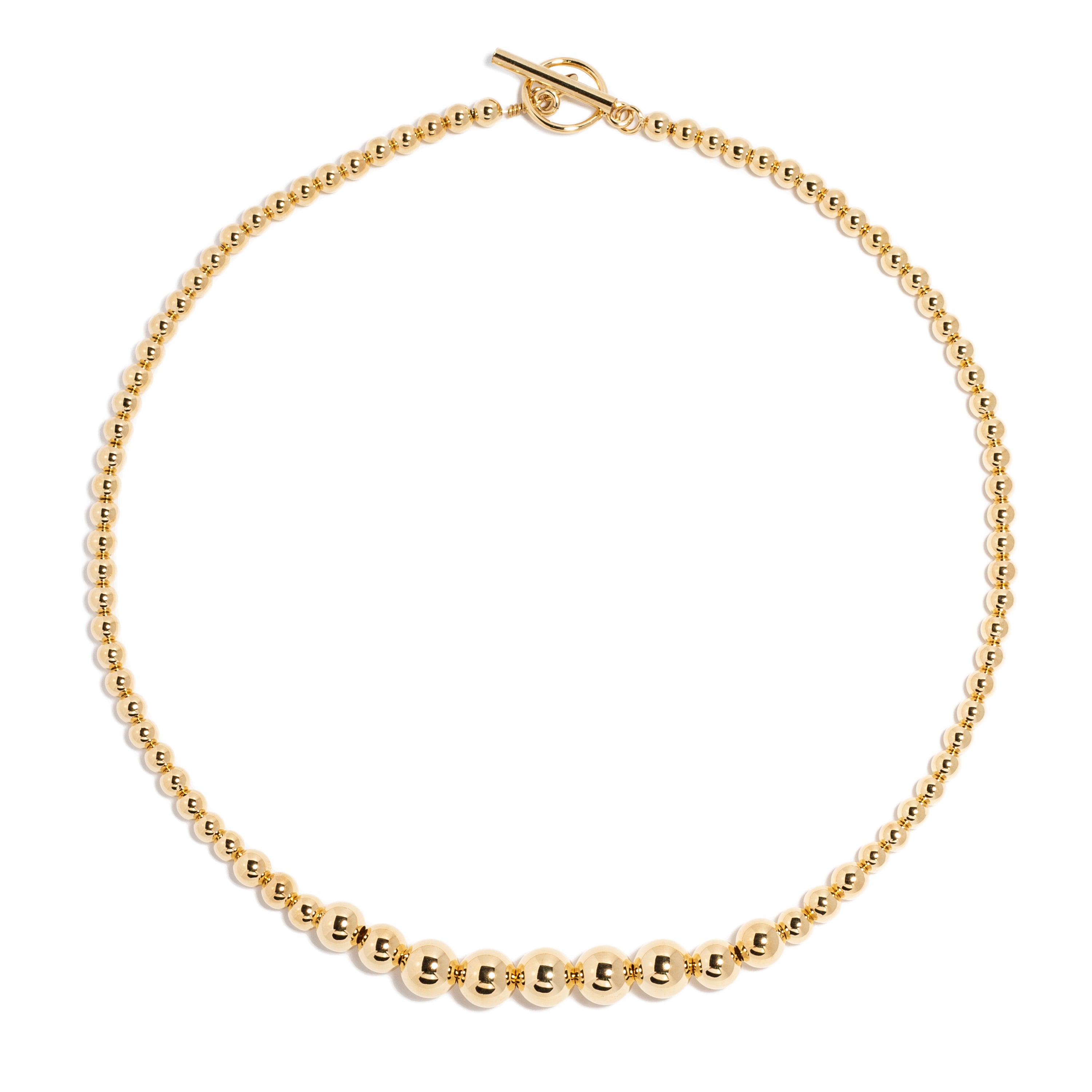 Gold necklace made of small round beads, featuring a prominent toggle clasp for an elegant and minimalistic design.