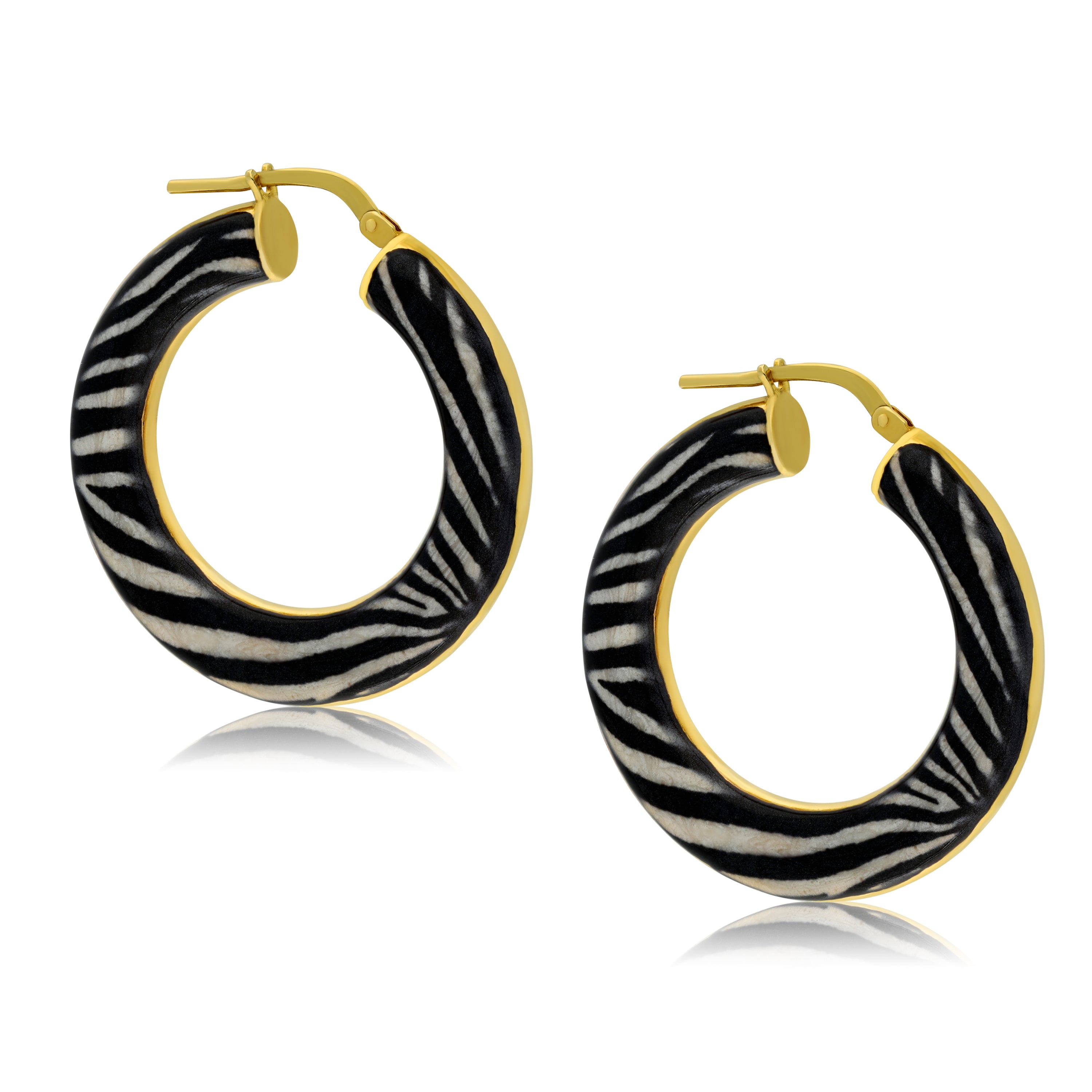 Stylish gold-tone hoop earrings adorned with a striking zebra print design. The earrings feature a large circular shape covered in soft black and white stripes, combining animal print with a modern, elegant hoop design. These earrings are perfect for adding a bold statement to any outfit.