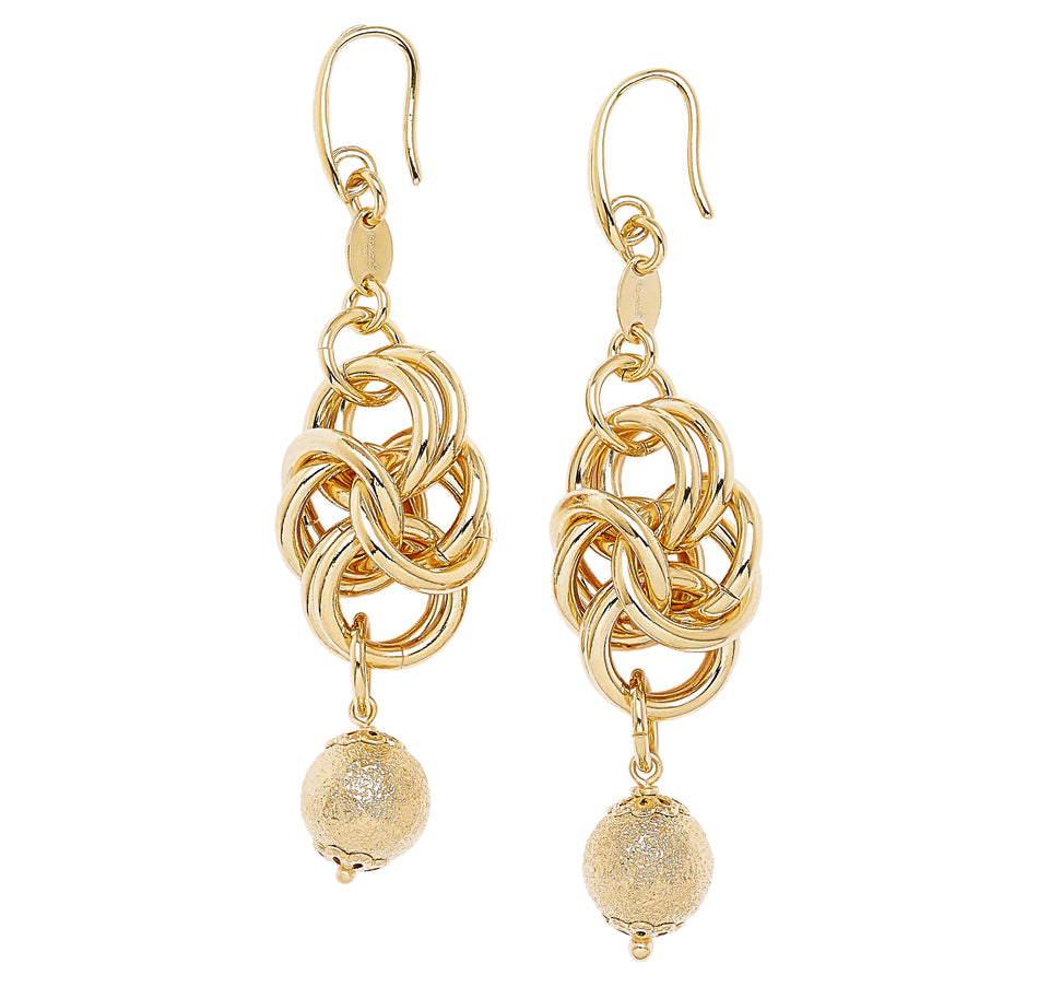 A pair of elegant gold-tone earrings featuring a unique interlocking chain design at the top. Below the chain, there are two textured gold beads hanging gracefully, adding a touch of sophistication to the piece. The earrings are suspended from delicate gold hooks, allowing for a comfortable fit. The combination of the intertwined links and the shimmering beads creates a stunning visual effect, making these earrings perfect for both casual and formal occasions. The overall design showcases a modern aesthetic