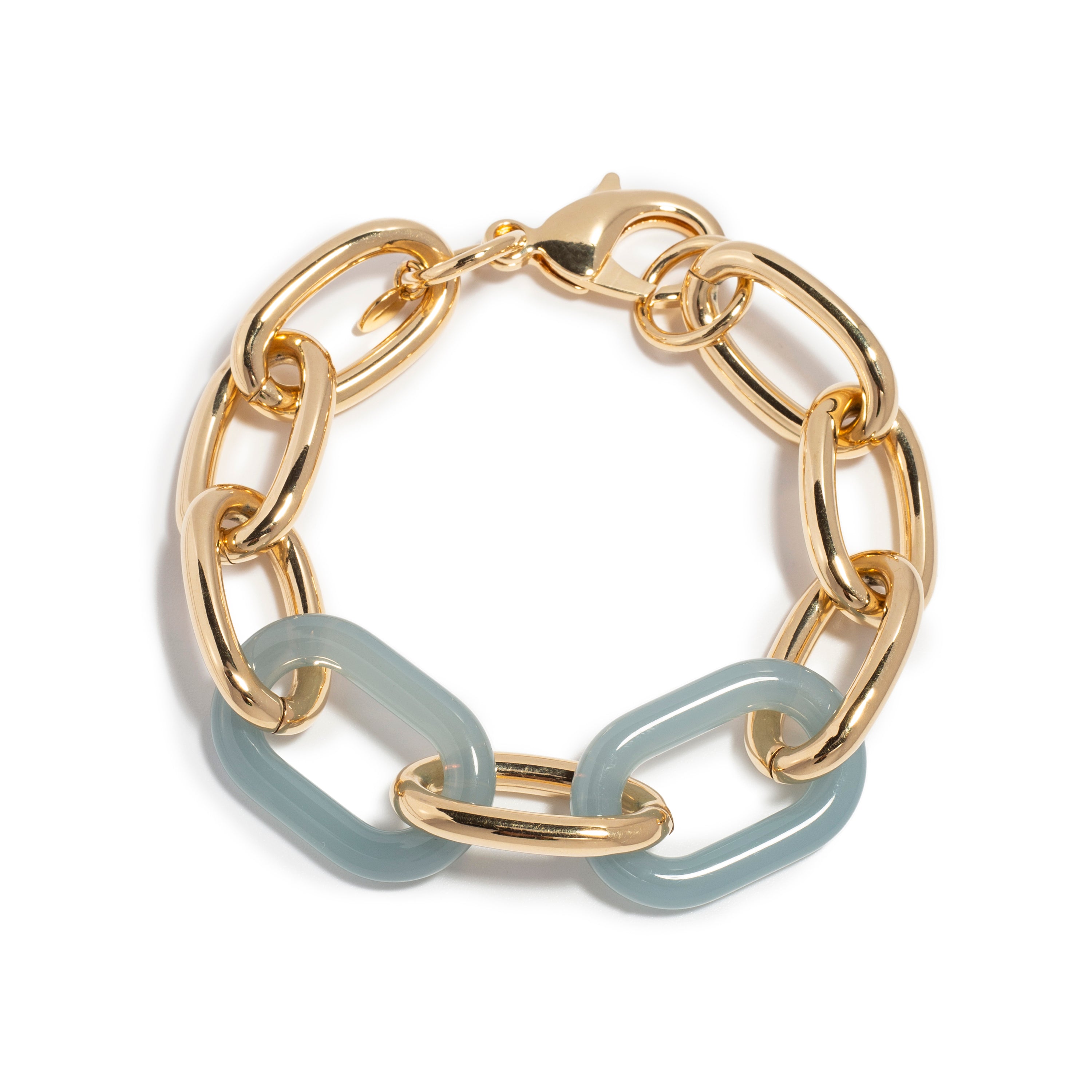 A stylish bracelet featuring a combination of gold-tone metal links and soft blue resin links. The bracelet alternates between shiny gold oval and round links with smooth, rectangular blue links, creating a chic and contemporary design. It is fastened with a classic lobster clasp, making it a versatile accessory for any outfit.