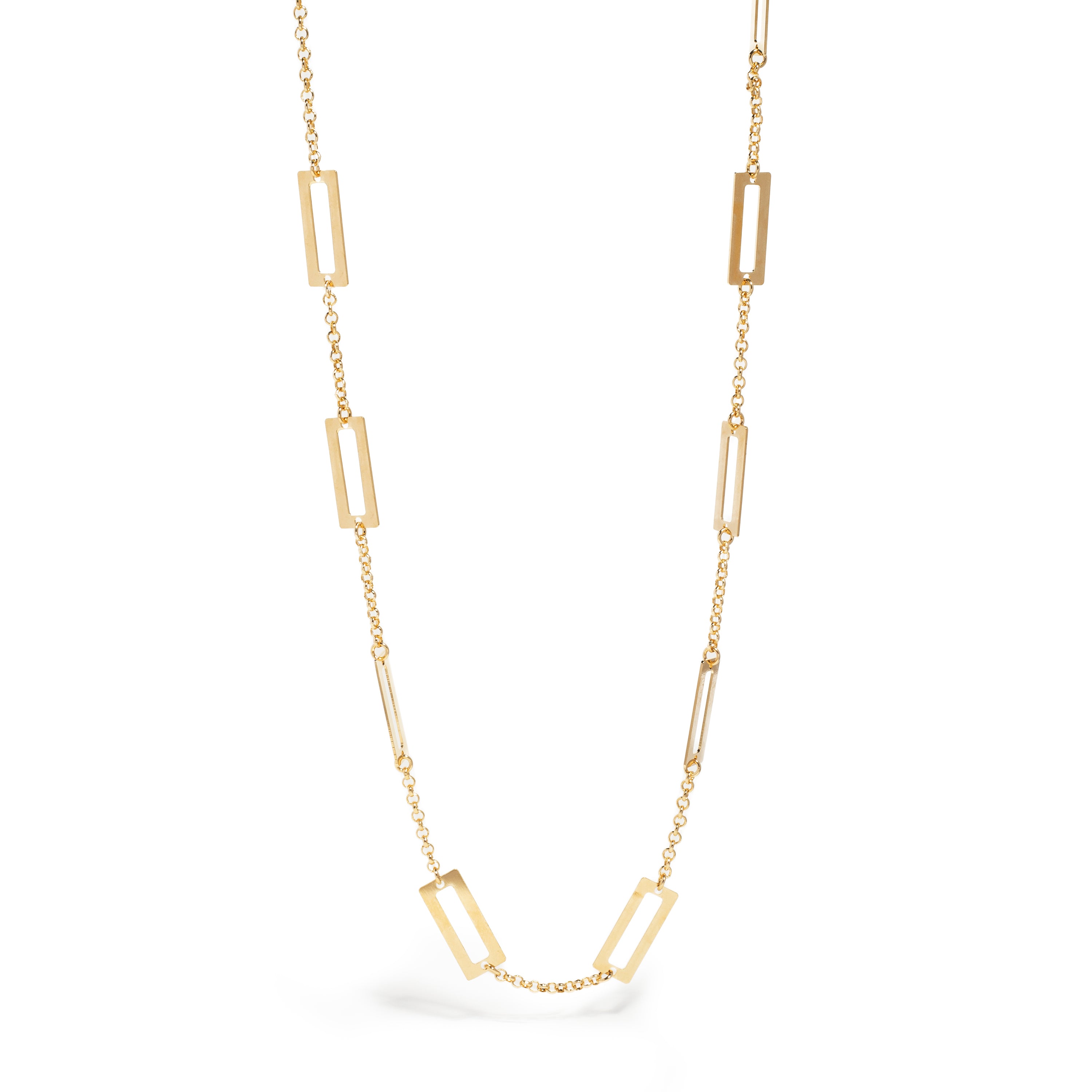 A chic gold necklace featuring a delicate chain adorned with alternating rectangular and elongated links. The minimalist design combines smooth and textured elements, creating a modern and elegant look that enhances any outfit.