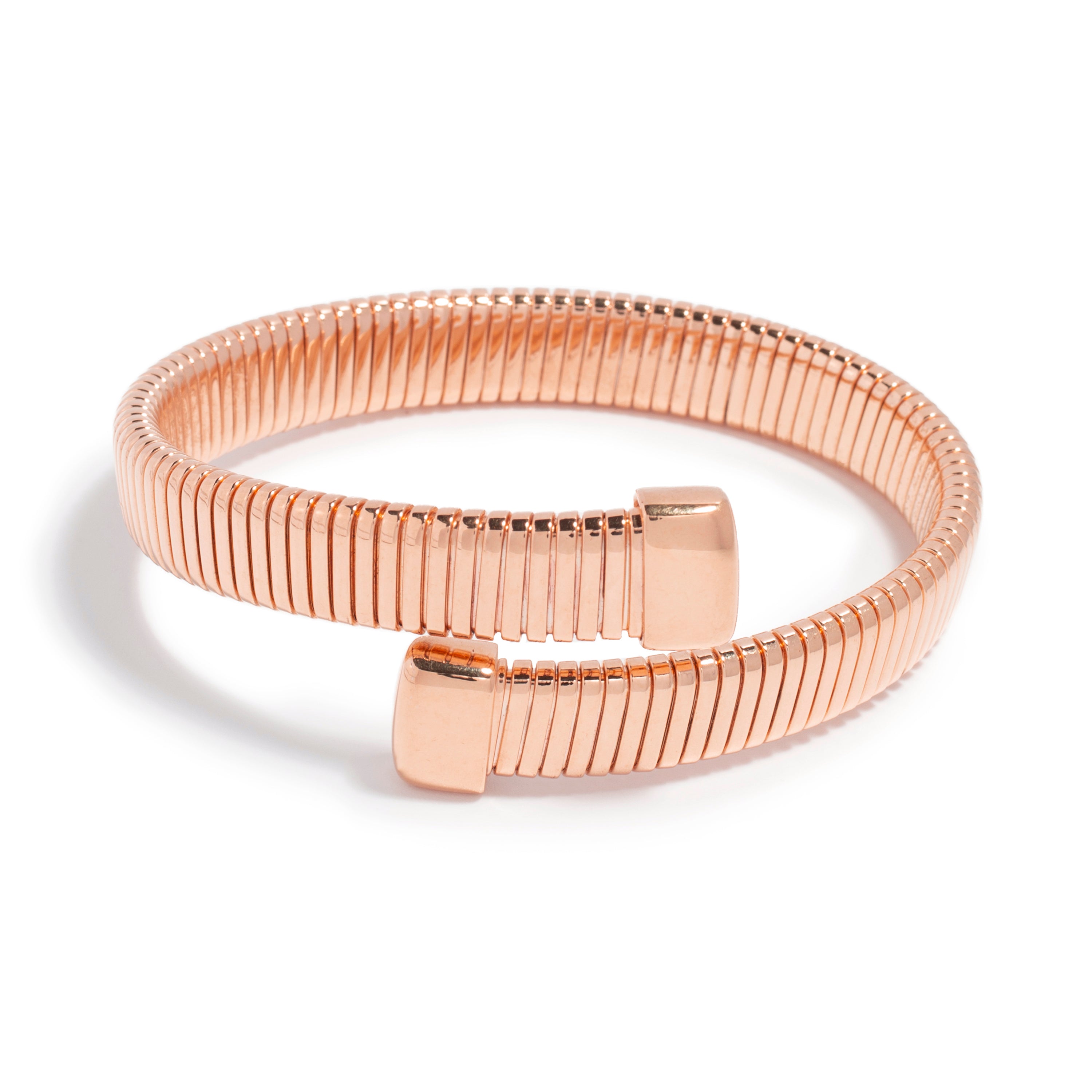 A chic rose gold bracelet featuring a flexible, coiled design made of slender, interlocking segments. The bracelet has square-shaped end caps that contribute to its modern aesthetic, making it a stylish accessory for any outfit. Its sleek and polished finish highlights the elegance of the piece.
