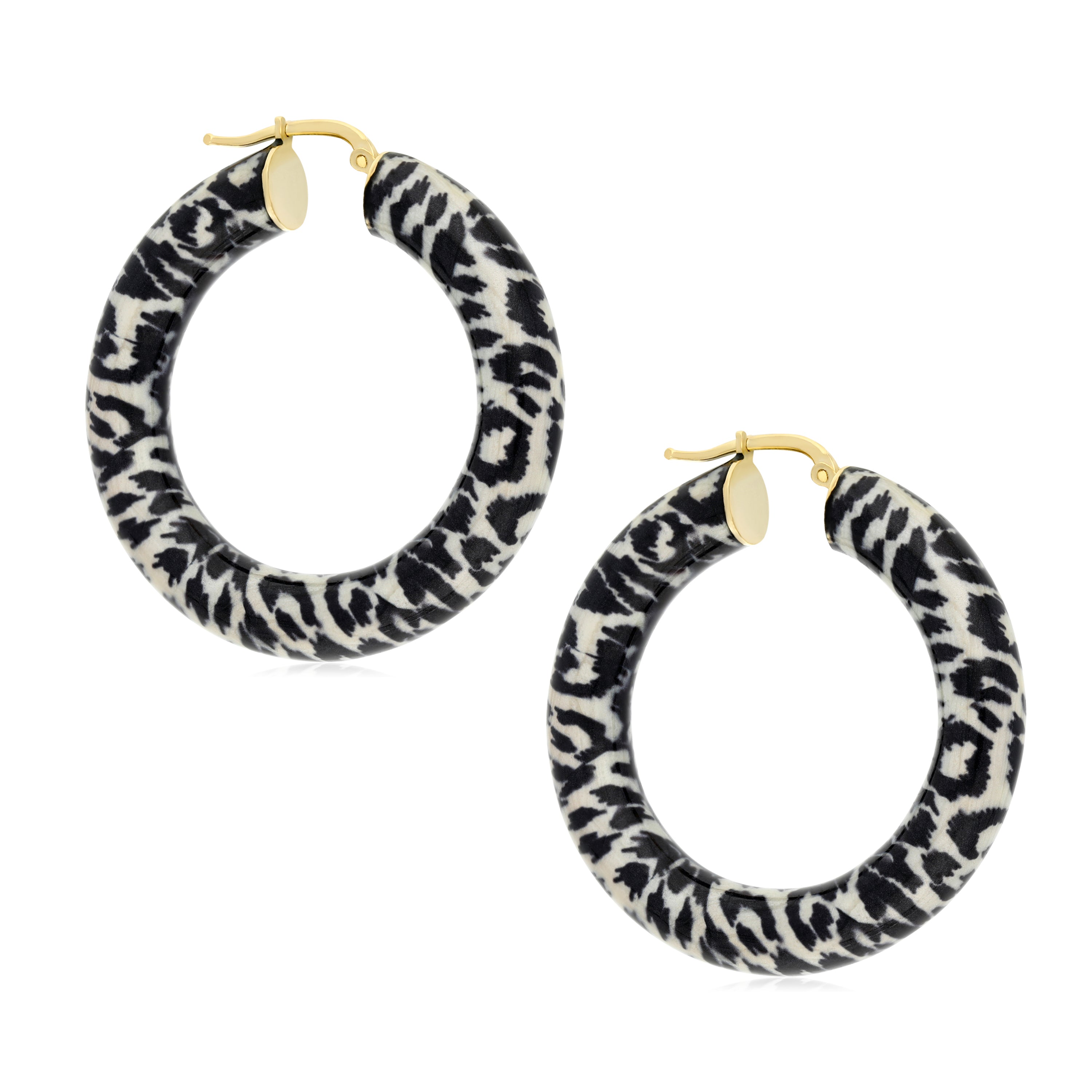 A pair of oversized hoop earrings featuring a striking leopard print design. The hoops are made of a lightweight material with a blend of black and cream colors, showcasing a bold leopard pattern. They are accented with gold-tone metal components, including a simple hinge clasp for secure fastening. These fashionable earrings are perfect for adding a playful and stylish touch to any outfit, ideal for both casual and trendy occasions.