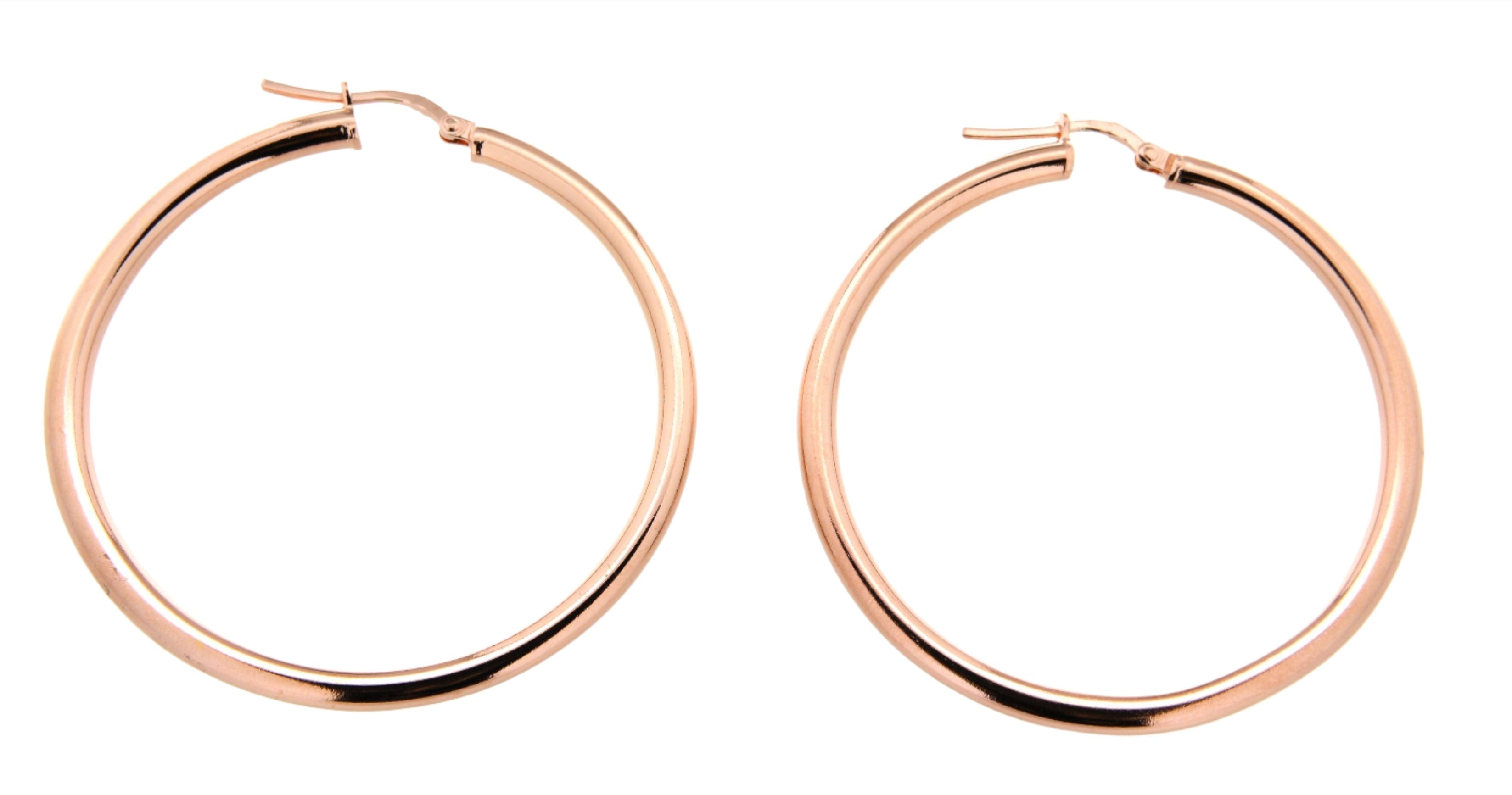 Stylish rose gold-tone hoop earrings with a polished finish. These medium-sized hoops feature a classic design, adding a chic and elegant touch suitable for various occasions, from casual outings to formal events.