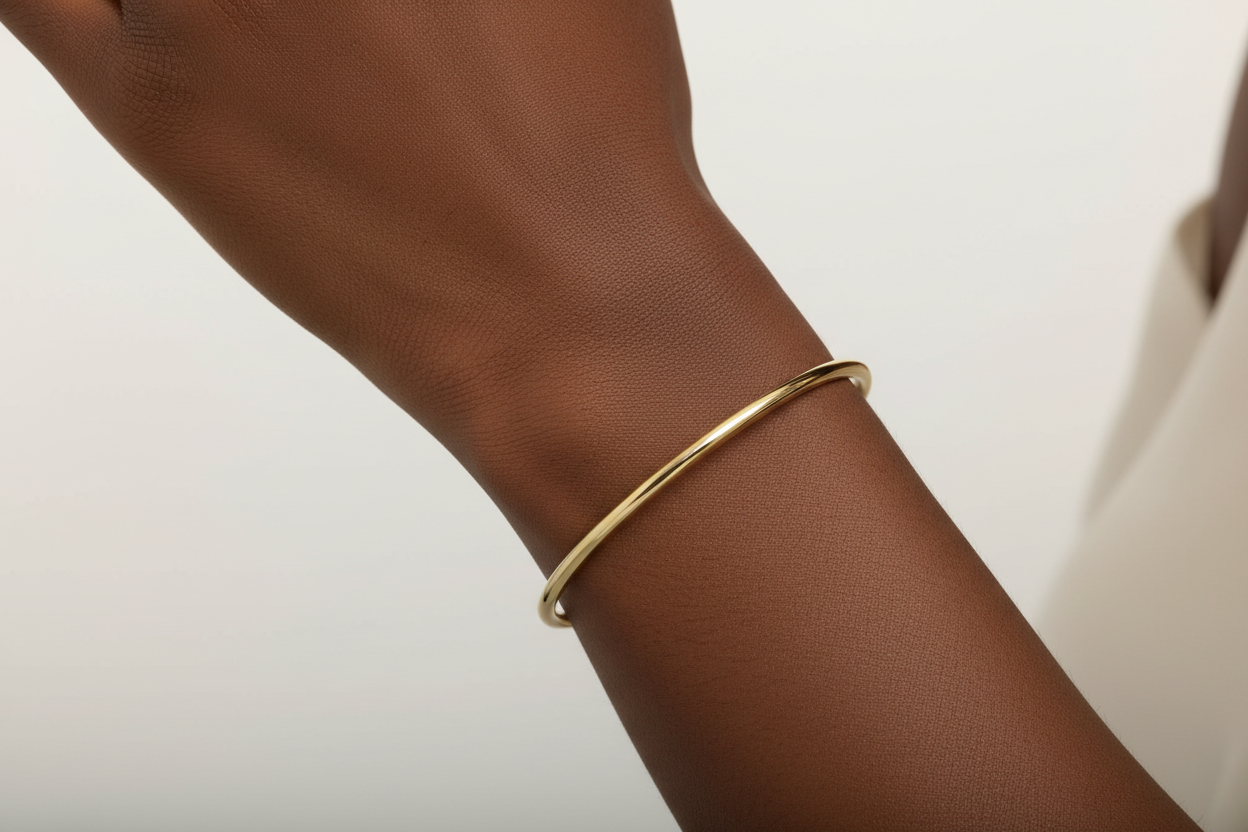 7.25 inch High Polish Slip On Bangle on Darker Skin Model