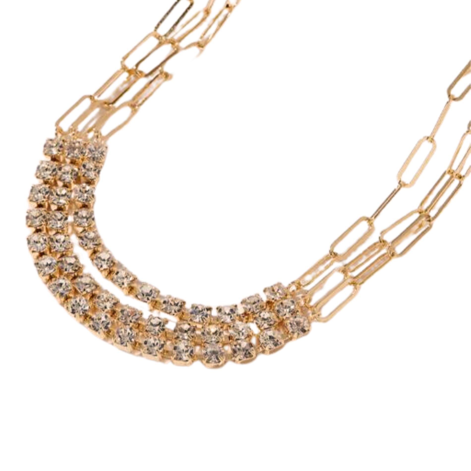 Elegant layered gold-toned necklace featuring double rows of sparkling rhinestones, designed for a modern and glamorous aesthetic.