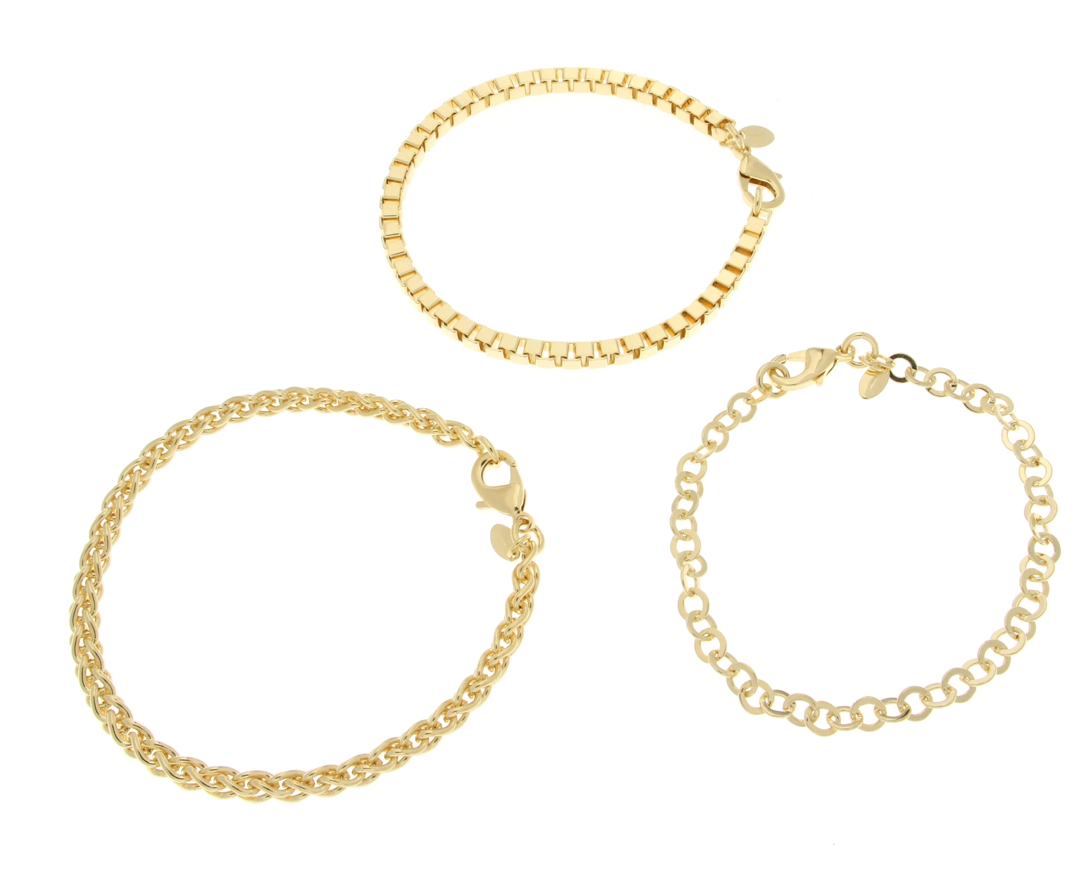 Image of three gold bracelets arranged together: a smooth rectangular link bracelet at the top, a twisted chain bracelet in the middle, and a delicate circular link bracelet at the bottom, all secured with clasps.