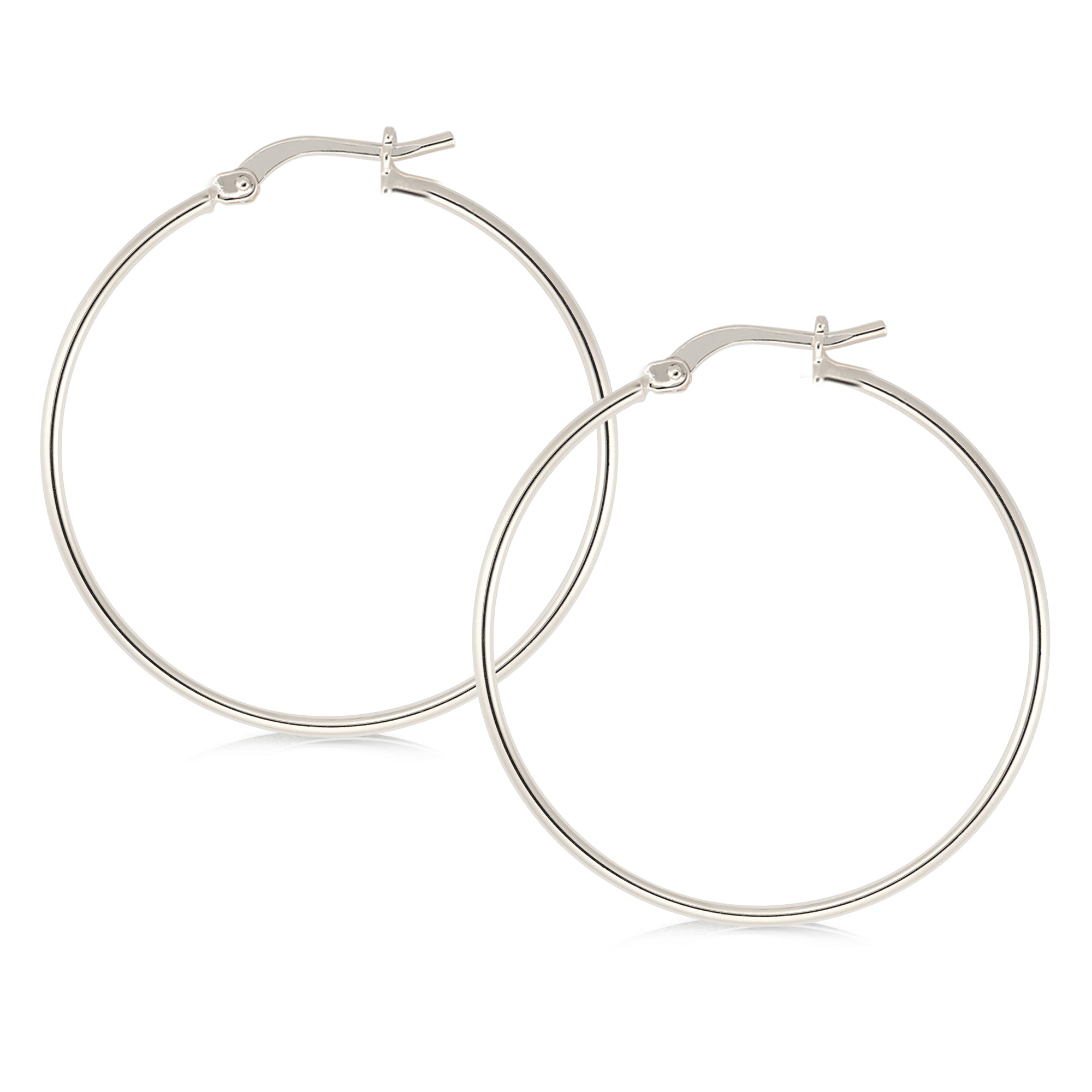 Elegant silver-tone hoop earrings featuring a minimalist design. The hoops are thin and polished, offering a refined and stylish look. They secure with a classic latch closure, making them suitable for both casual and formal occasions.