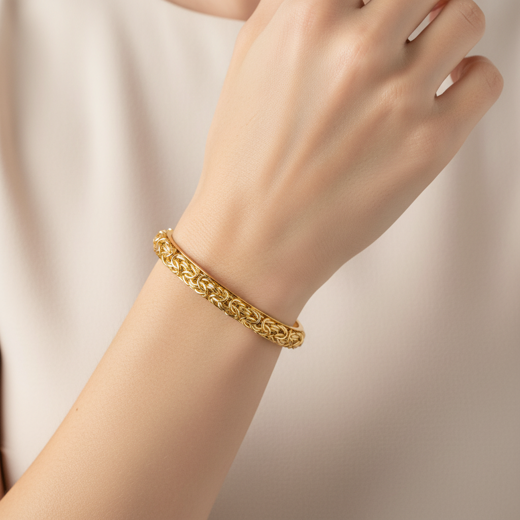 Byzantine gold cuff bangle on model's wrist