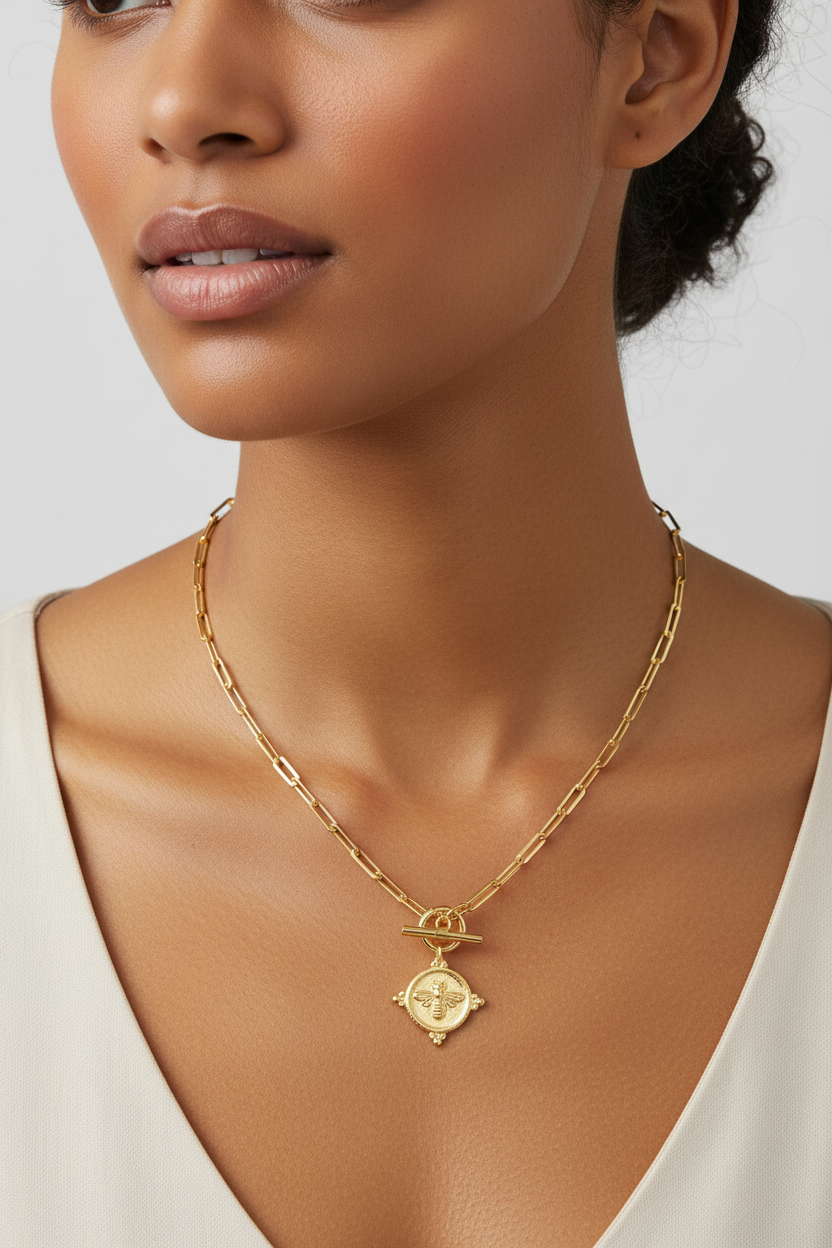 Diverse model wearing bee medallion necklace