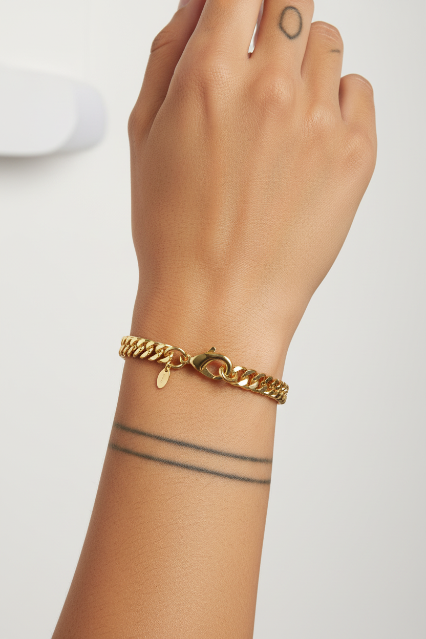 Diverse model wearing gold curb chain bracelet