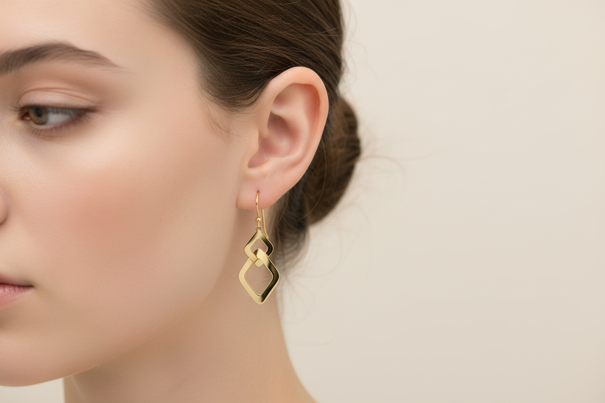 Double diamond-shaped links earrings on model - smaller