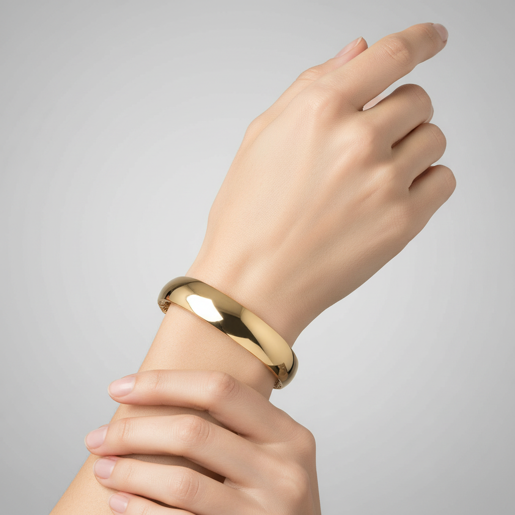 Gold bracelet on model's wrist