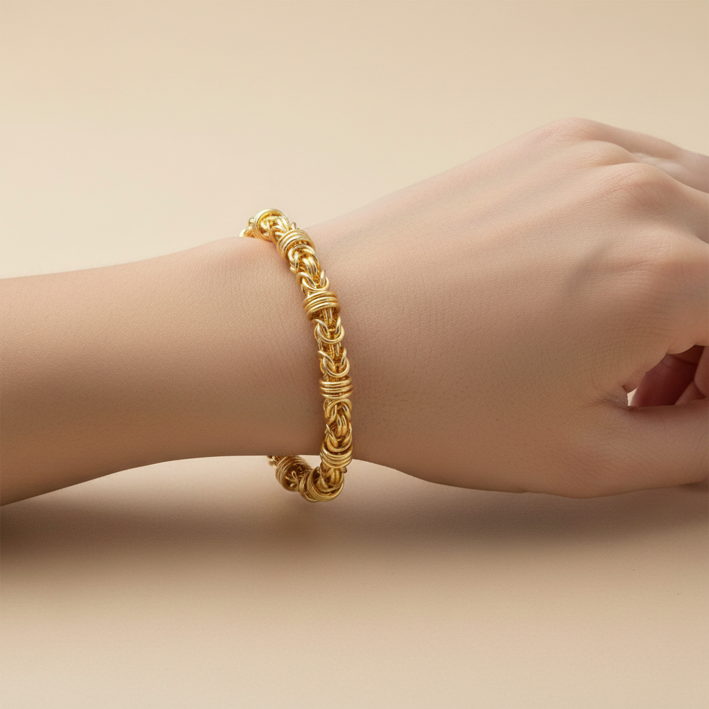Gold Byzantine chain bracelet with rondel accents on model's wrist