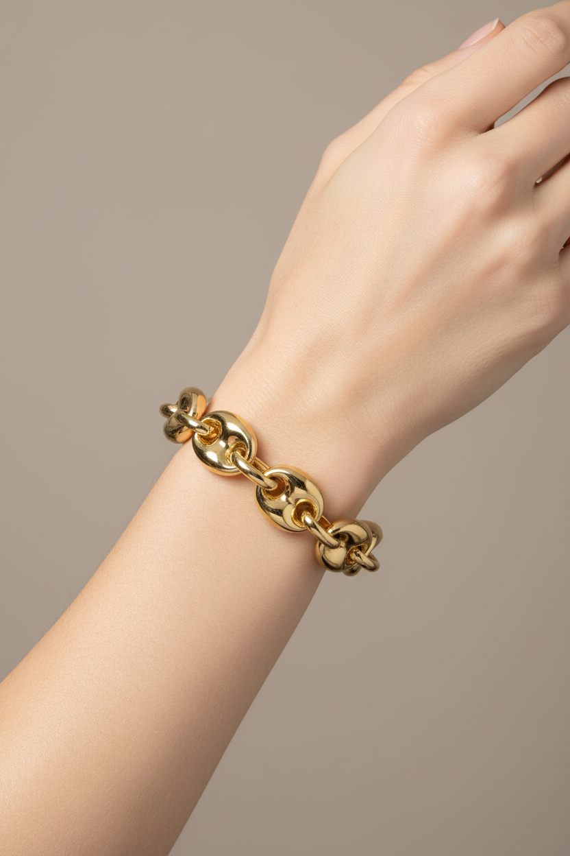 Gold chain link bracelet on model