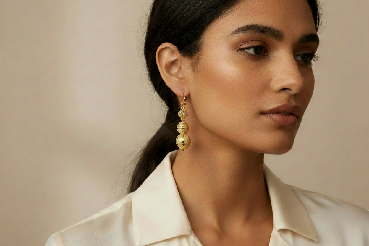 Gold earrings on model - petite size