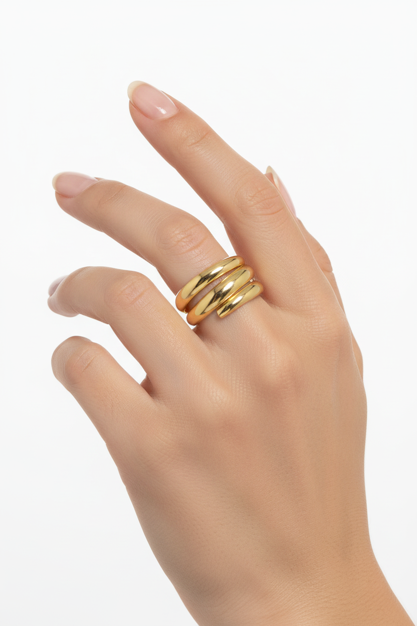 Gold triple band ring on hand model