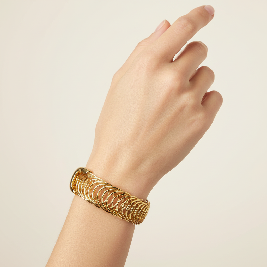 Gold wrap bracelet on model's wrist