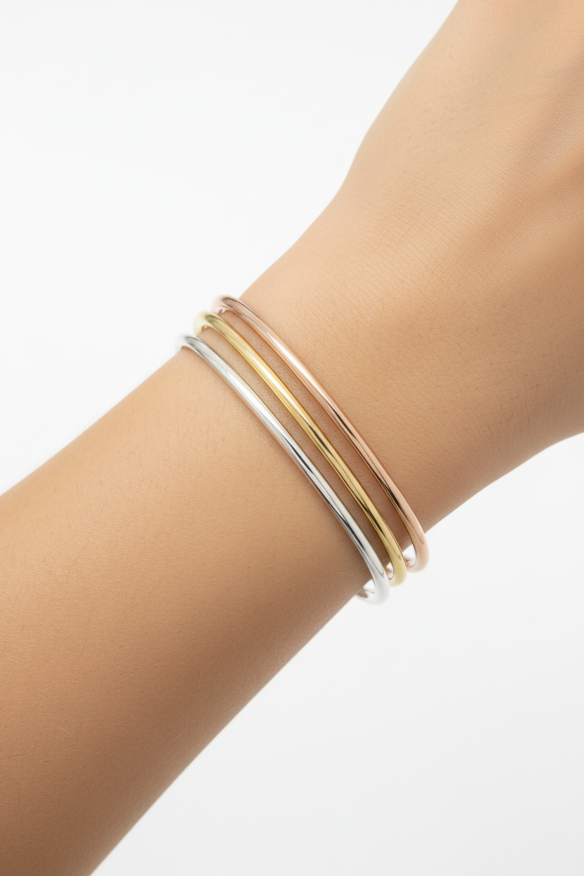 Model wearing three tri-color bangles