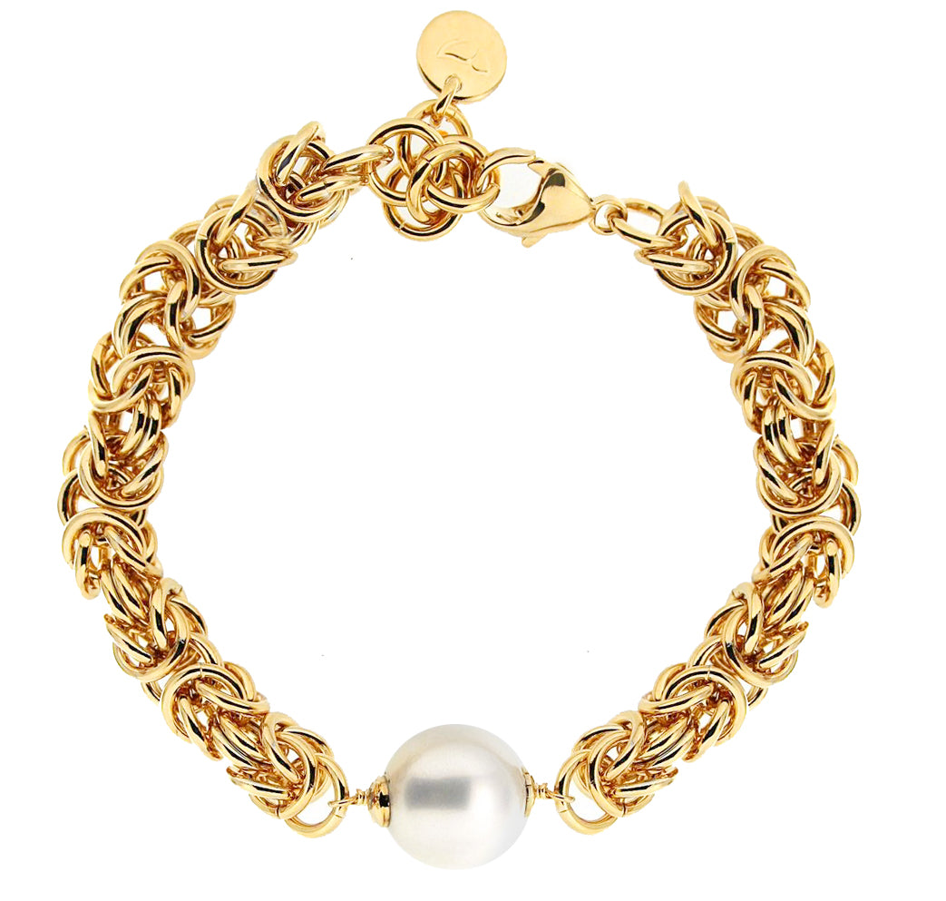 A luxurious gold bracelet featuring a twisted design interspersed with elegant links. The bracelet is adorned with a prominent, lustrous pearl at its center, adding a touch of sophistication. It closes securely with a clasp, making it a chic addition to any jewelry collection, suitable for both casual and formal occasions.