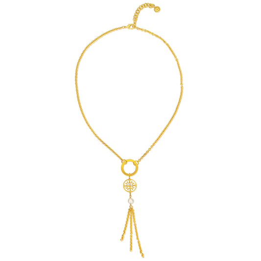 A stylish gold necklace featuring a delicate chain design. The centerpiece includes two interconnected gold rings, enhancing its modern aesthetic. Below the rings hangs a circular pendant with intricate cut-out patterns, accompanied by a single elegant pearl. The necklace also showcases several fine gold chains cascading down from the pendant, creating a lovely tassel effect.