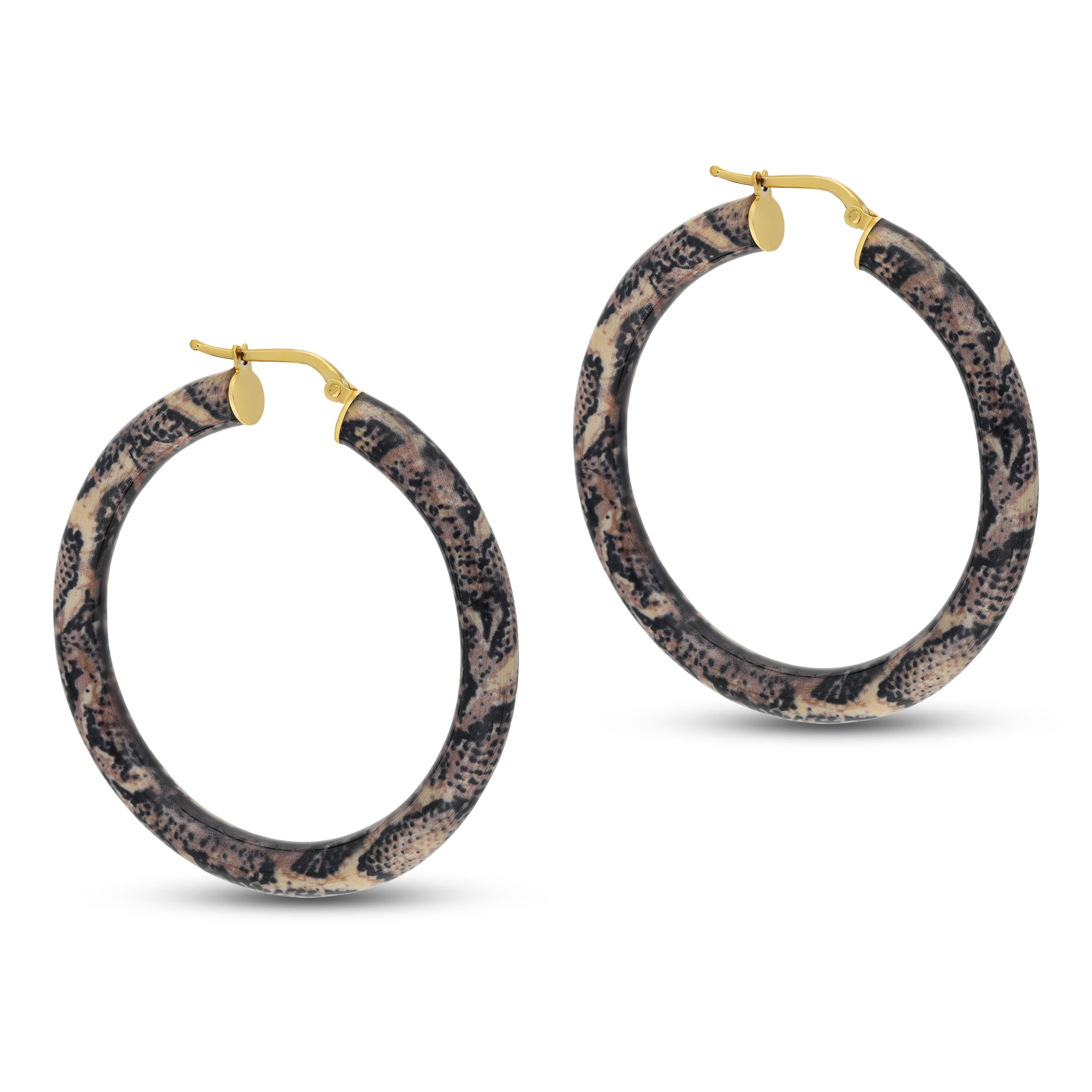 A pair of oversized hoop earrings featuring a unique snake print design. The hoops are made of a lightweight material with a combination of cream and dark tones, resembling a snake's skin pattern. They are finished with gold-tone metal components, including a simple hinge clasp for secure fastening. These statement earrings add a bold and fashionable touch to any outfit, perfect for casual or trendy looks.