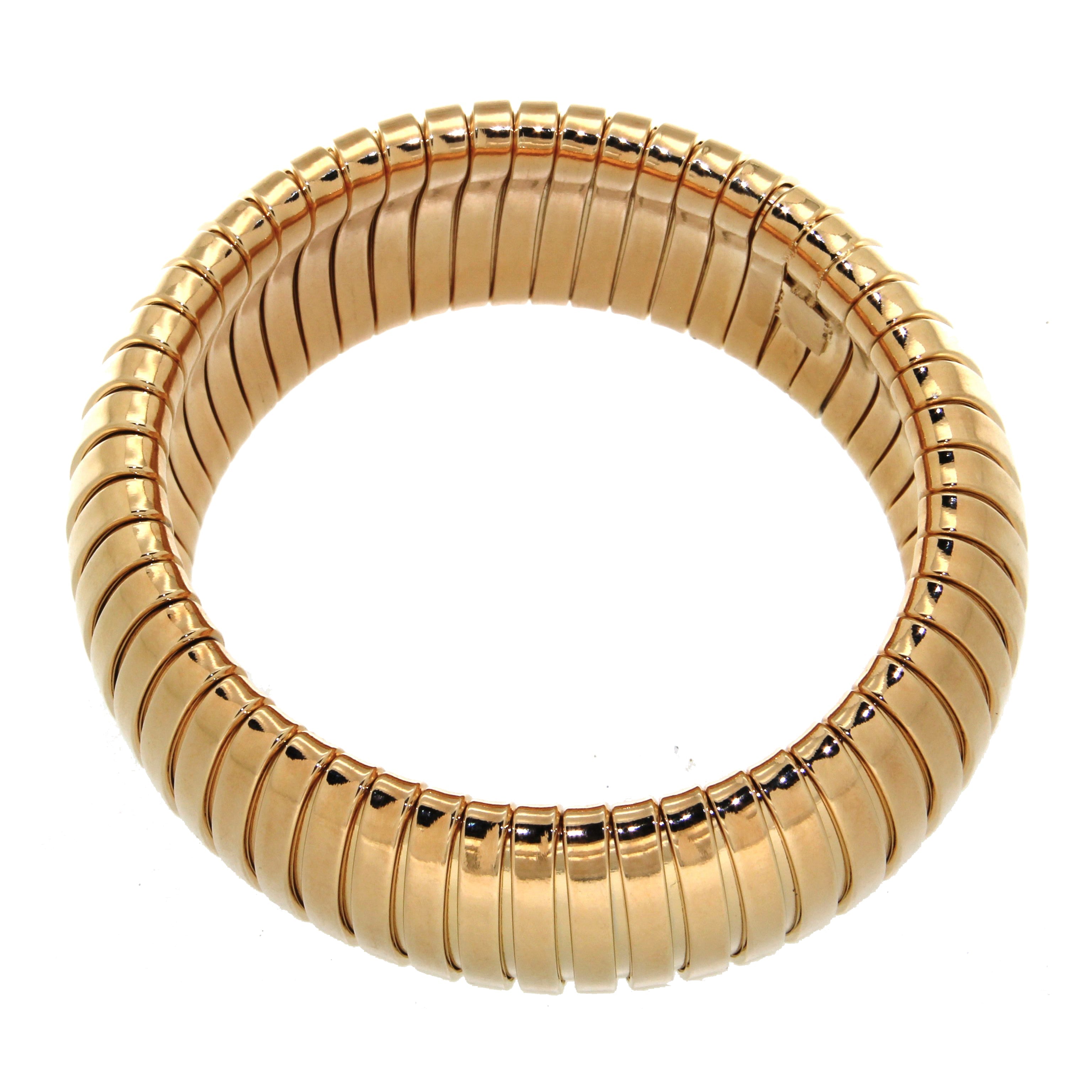 Close-up of a smooth gold cuff bracelet with a clean, polished finish and rounded edges for a sophisticated look.